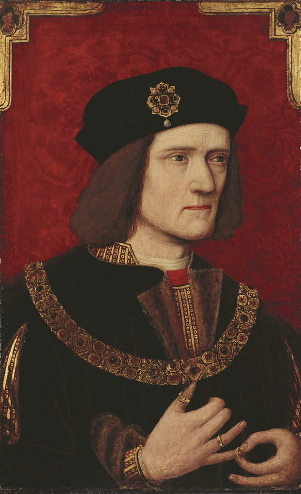 A head and shoulders portrait of Richard III, on a red background with gold embellishment in the upper corners. His face is turned slightly to the right, with a serious expression; at the bottom of the frame, his hands are shown in the middle of removing a ring from his right little finger. The heights of his shoulders are visibly uneven. He wears a black robe, possibly fur-lined, over a gold patterned doublet with a flash of red at the collar. A chain of office hangs across his chest. His black hat bears a gold, ruby, and pearl brooch in the shape of a stylised rose.