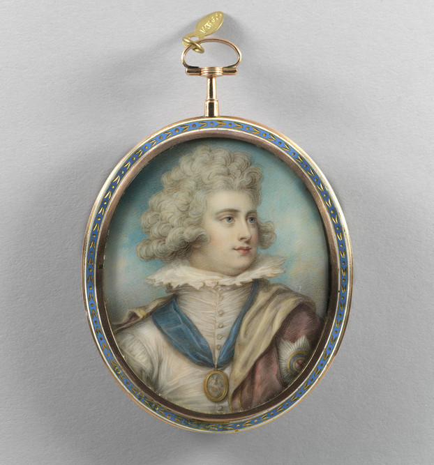A miniature portrait in a blue and gold oval frame, with a ring attached so that it can be attached to a chain or worn as a pendant. The subject is George IV as a young man in seventeenth-century costume: he is in three-quarter profile, facing to the right. He has curly powdered hair and wears a cream doublet with a high starched collar; a miniature portrait, possibly of two women, is on a blue ribbon around his neck, and a pink cloak is draped across his shoulders, with the star of the Order of the Garter embroidered on the shoulder.